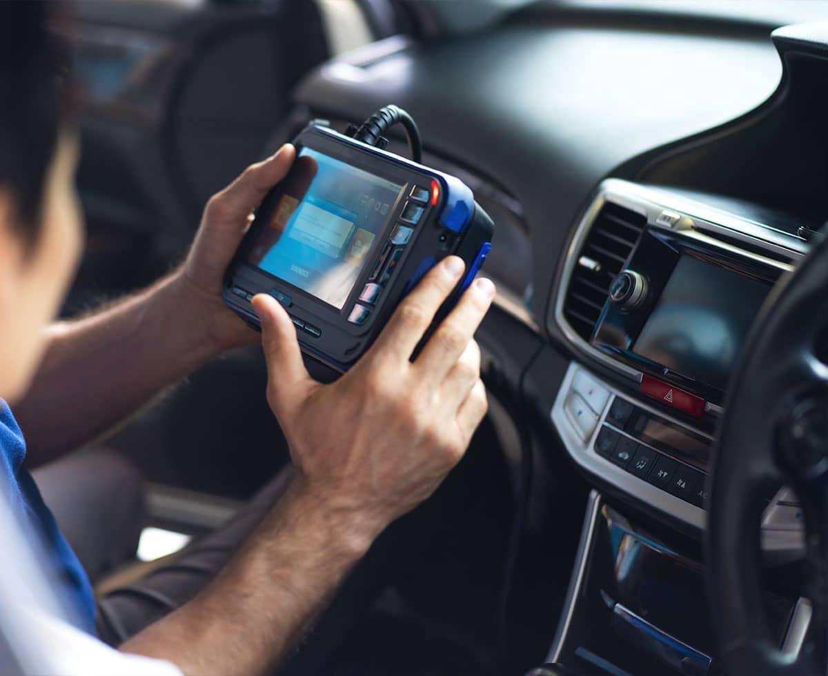 Technician performing computer diagnostics and check engine light scanning at Gazy Auto Repair in Richmond Hill NY